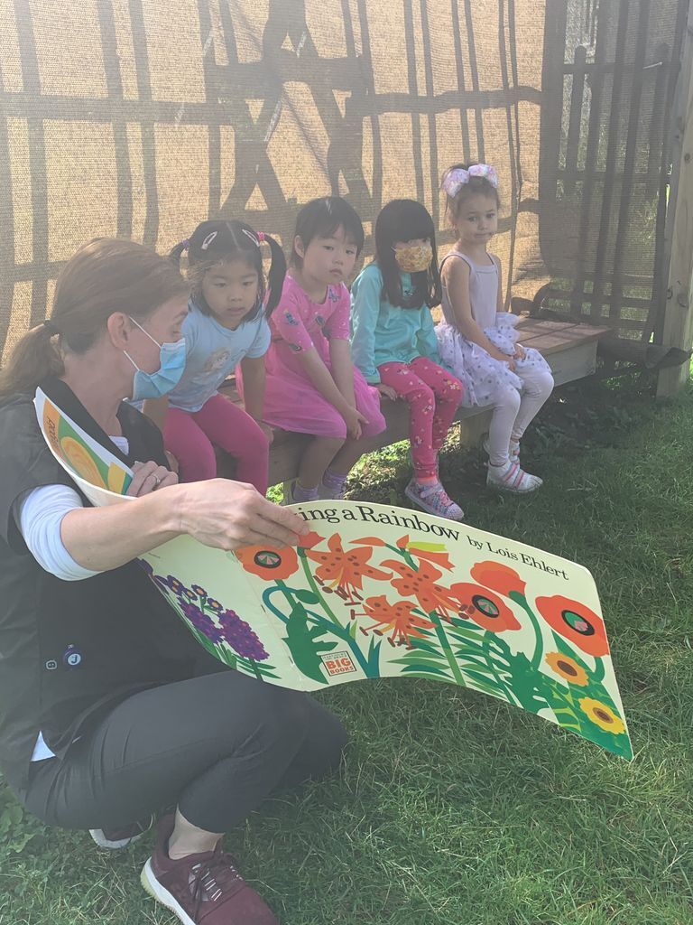reading a book in the garden prek.jpg